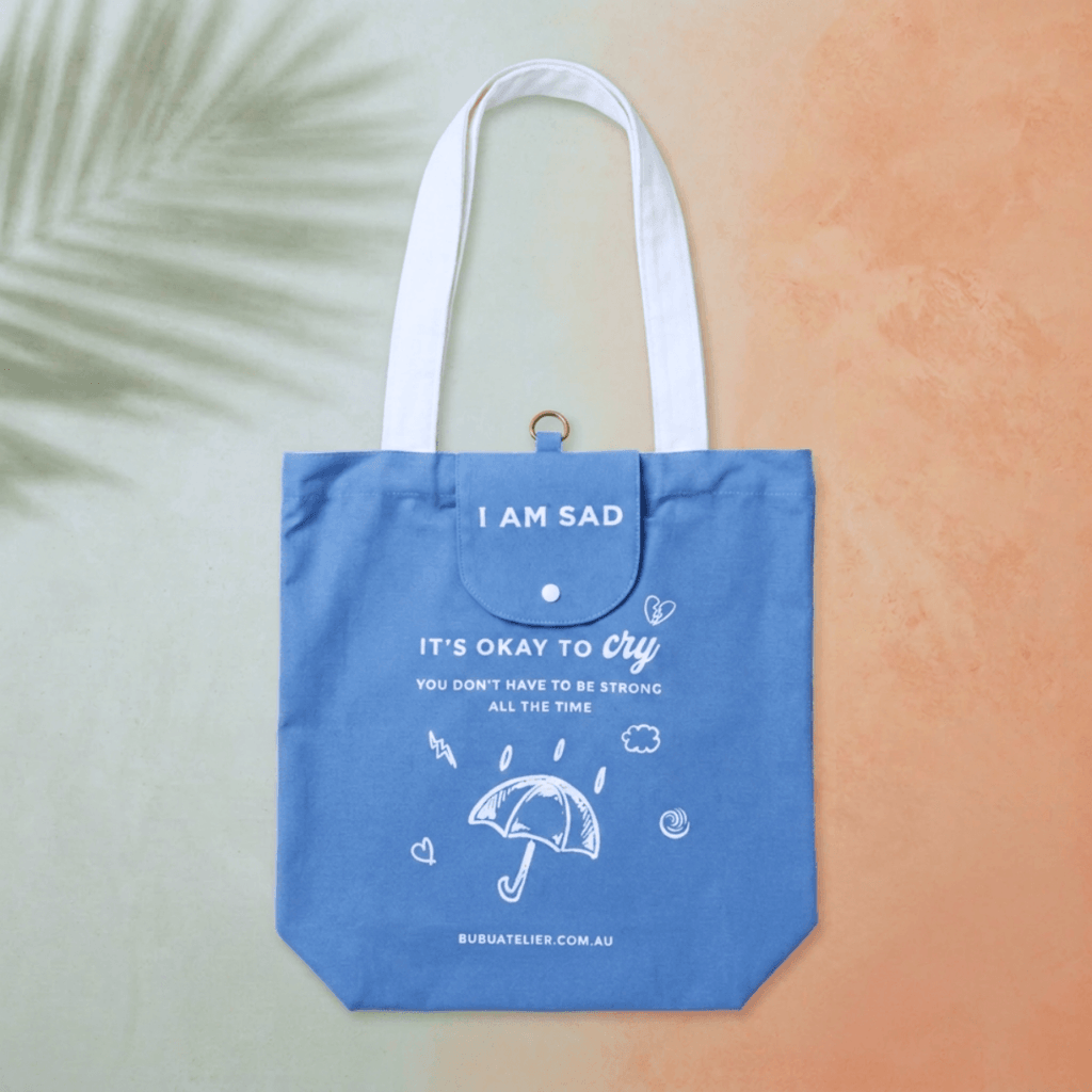 Emotional Burrito Foldable Tote Bag I Am Sad flat lay — foldable canvas tote bag by Bubu Atelier